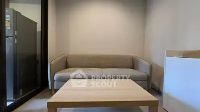 Modern living room with cozy sofa and sleek wooden coffee table, perfect for relaxation.