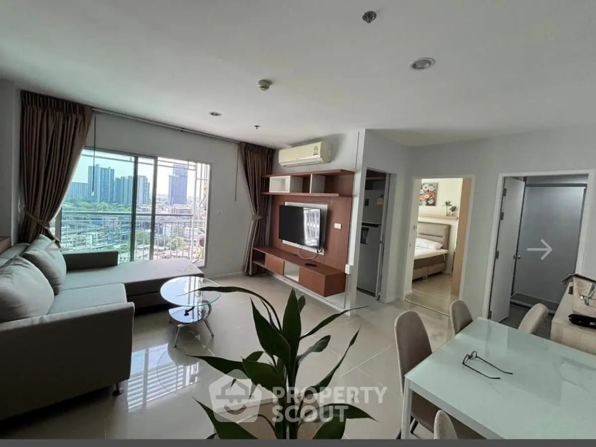 Spacious modern living room with city view, open layout, and elegant furnishings.