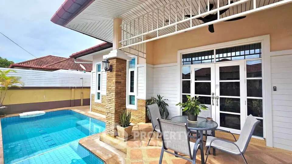 Charming villa with private pool and stylish patio, perfect for outdoor relaxation.