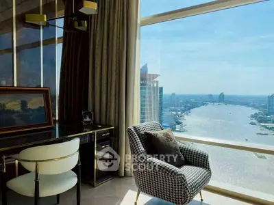 Luxurious high-rise apartment with stunning river view and elegant interior design.