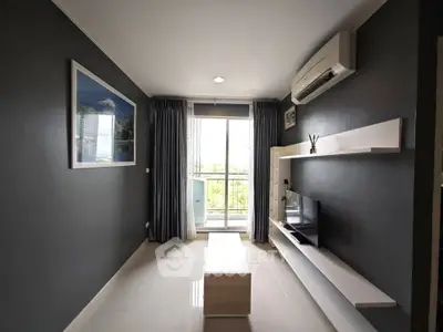 Modern living room with sleek design, featuring a wall-mounted TV, air conditioning, and a view of the balcony.