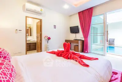 Luxurious bedroom with pool view, elegant decor, and modern amenities for a perfect stay.