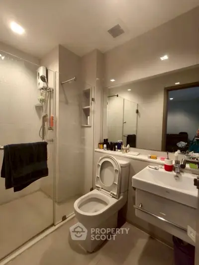 Modern bathroom with glass shower and sleek fixtures