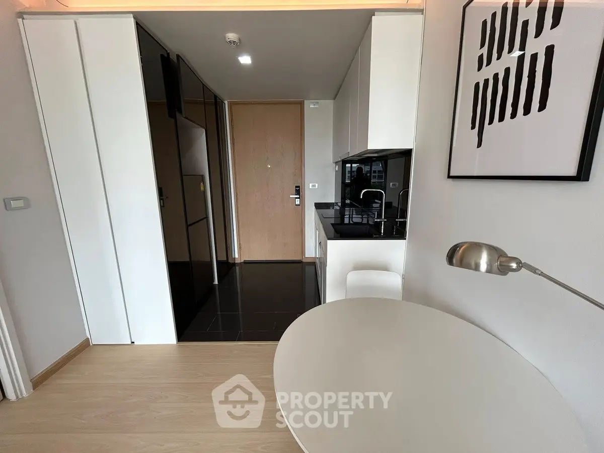 Modern studio apartment with sleek kitchen and stylish decor