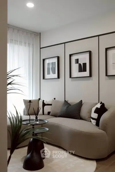 Modern living room with stylish decor and cozy seating area, perfect for relaxation.