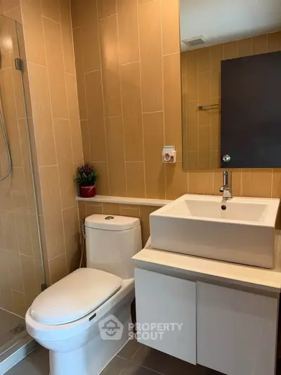 Modern bathroom with sleek fixtures and stylish tile design.