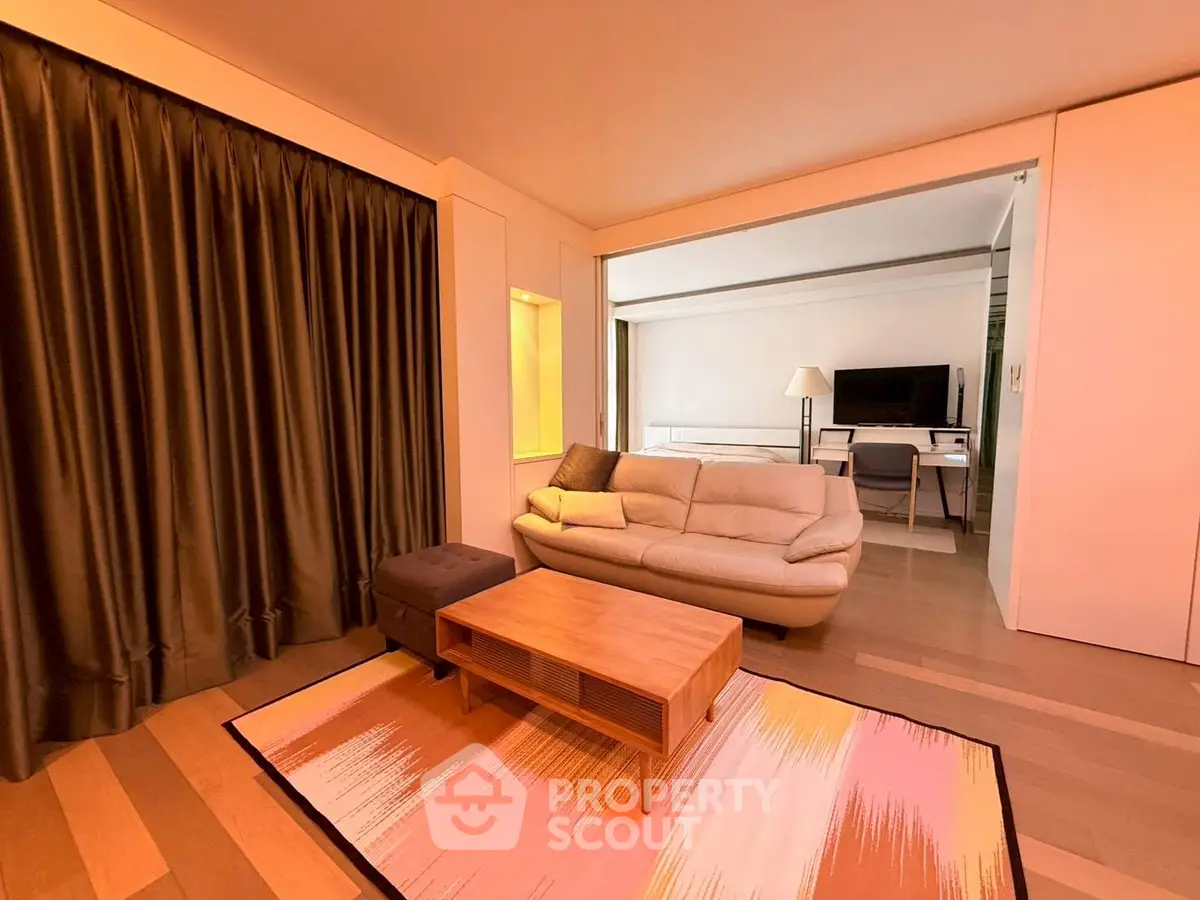 Spacious living room with modern decor and cozy seating area
