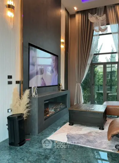 Luxurious living room with high ceilings, large windows, and modern fireplace, perfect for elegant gatherings.