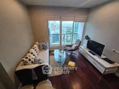 Modern living room with city view, stylish furniture, and large windows.