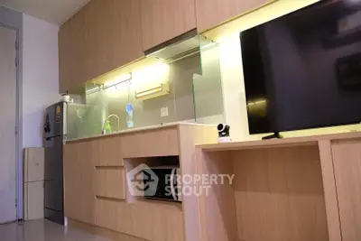 Modern kitchen with sleek cabinetry and built-in appliances in a stylish apartment.