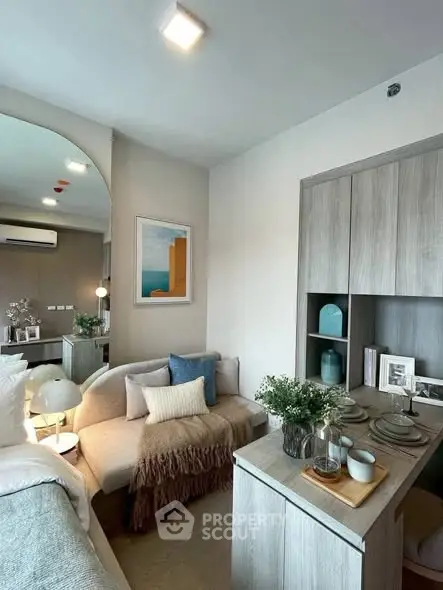 Modern living room with cozy sofa and stylish decor in a contemporary apartment.