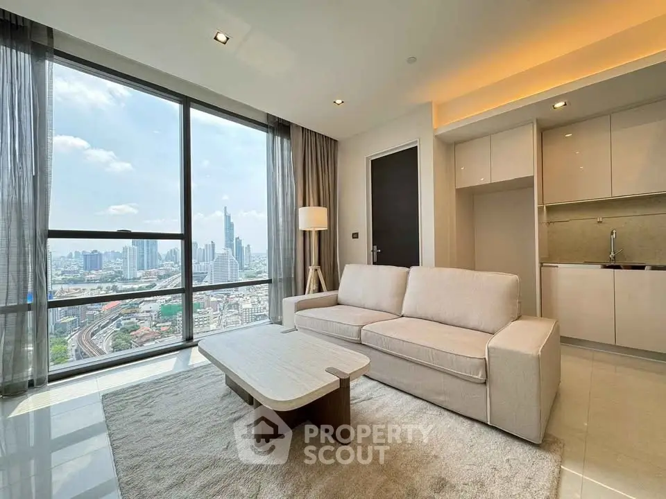 Modern living room with stunning city view, featuring sleek furniture and large windows in a high-rise apartment.