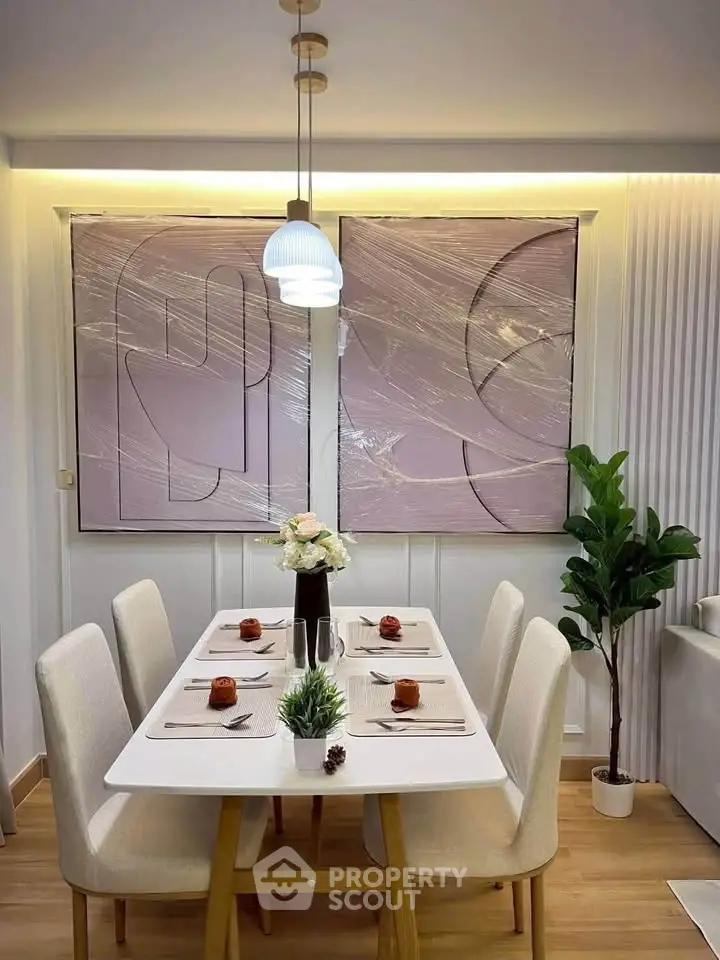 Modern dining room with elegant decor and stylish lighting, perfect for contemporary living.