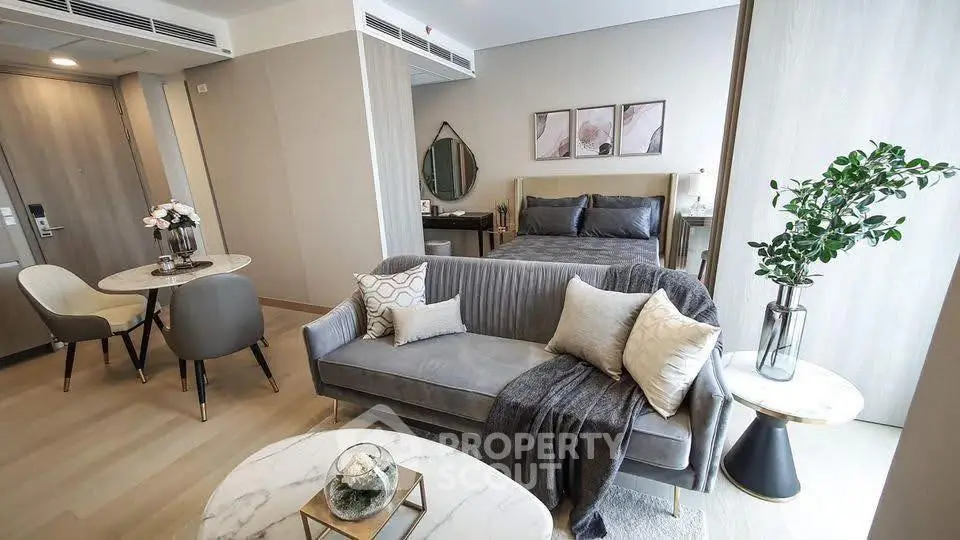 Stylish modern studio apartment with cozy living area and elegant decor