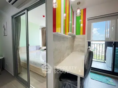 Modern apartment with colorful study nook and balcony view