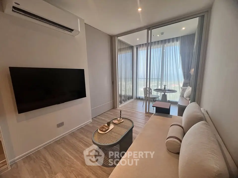 Modern living room with sleek design and large balcony view