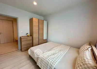 Cozy bedroom with modern wooden furniture and soft lighting