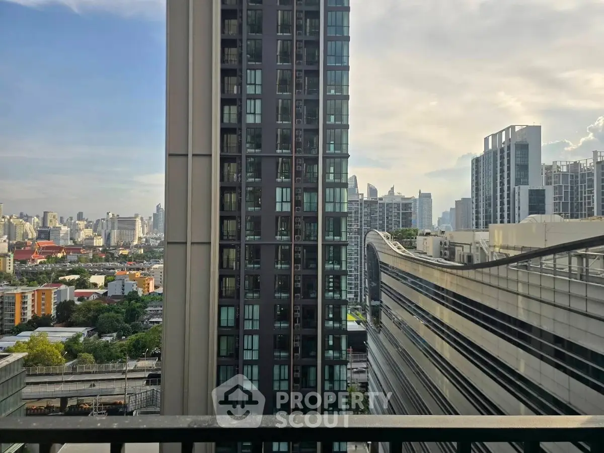 Stunning cityscape view from a high-rise balcony showcasing modern urban living.