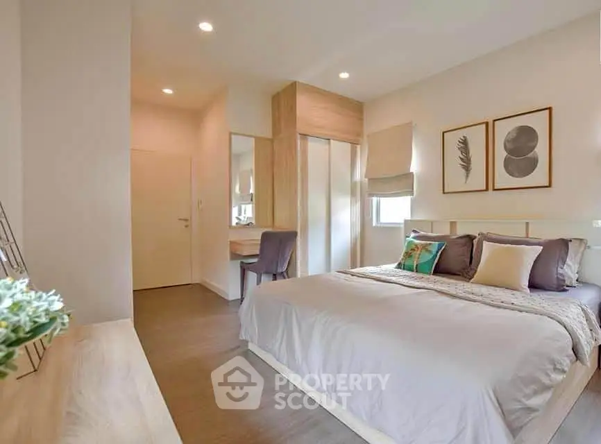 Spacious modern bedroom with elegant decor and natural light