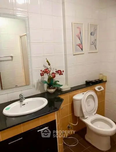 Charming bathroom with modern fixtures and elegant decor, perfect for a cozy home.