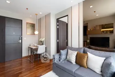 Modern living room with stylish decor and cozy seating in a contemporary apartment.