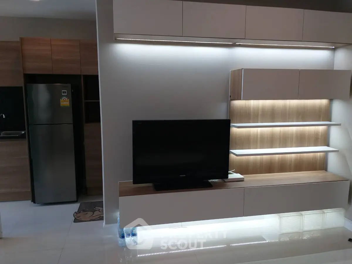 Modern living room with sleek TV unit and ambient lighting