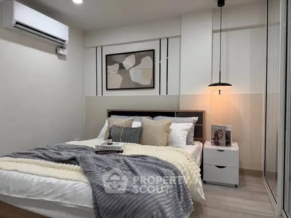 Cozy modern bedroom with stylish decor and soft lighting, perfect for relaxation.