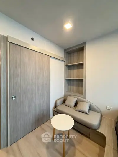 Modern compact living room with cozy sofa and built-in storage