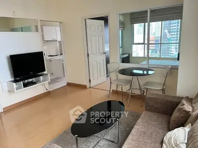 Modern living room with sleek furniture and city view, perfect for urban living.