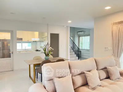 Spacious modern living room with open kitchen and elegant decor