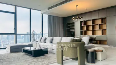 Luxurious modern living room with city view, elegant furniture, and stylish decor.