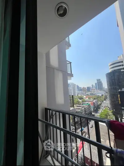 City view from a modern apartment balcony with urban skyline.