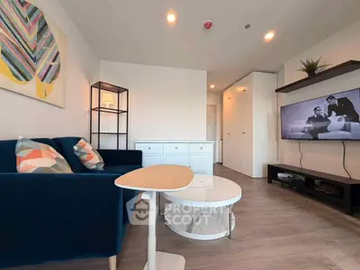 Modern living room with stylish decor and flat-screen TV