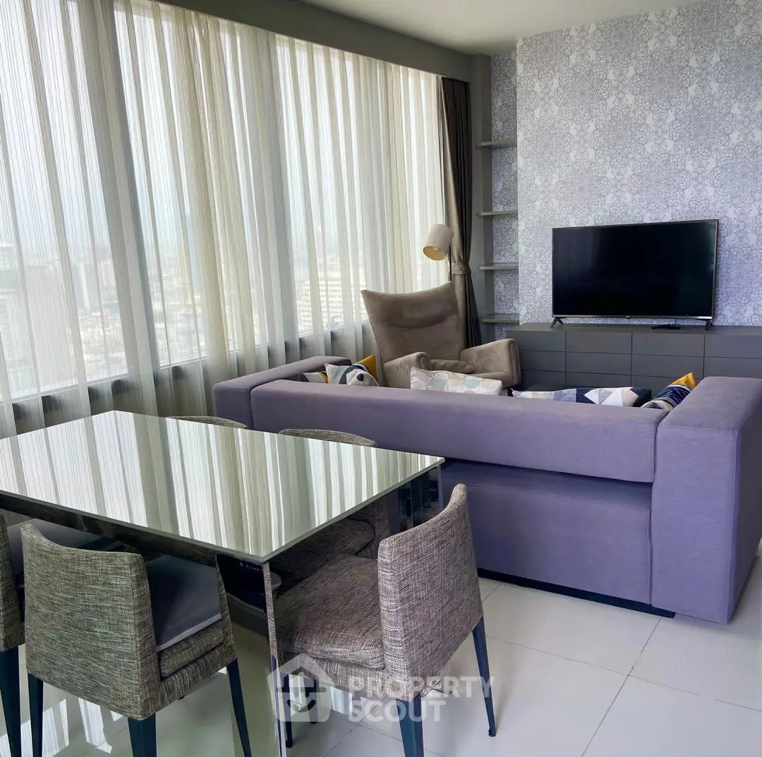Modern living room with panoramic windows and stylish furniture