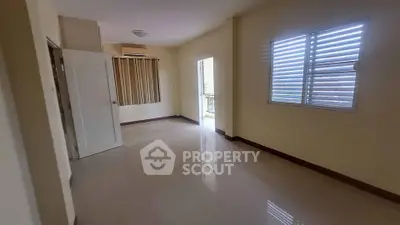 Spacious empty room with glossy floor and natural light, ideal for customization.