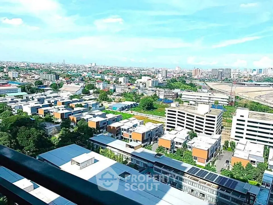 Stunning panoramic cityscape view from high-rise balcony showcasing urban landscape and skyline.