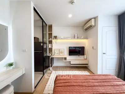 Modern bedroom with sleek design, featuring built-in shelves and air conditioning.