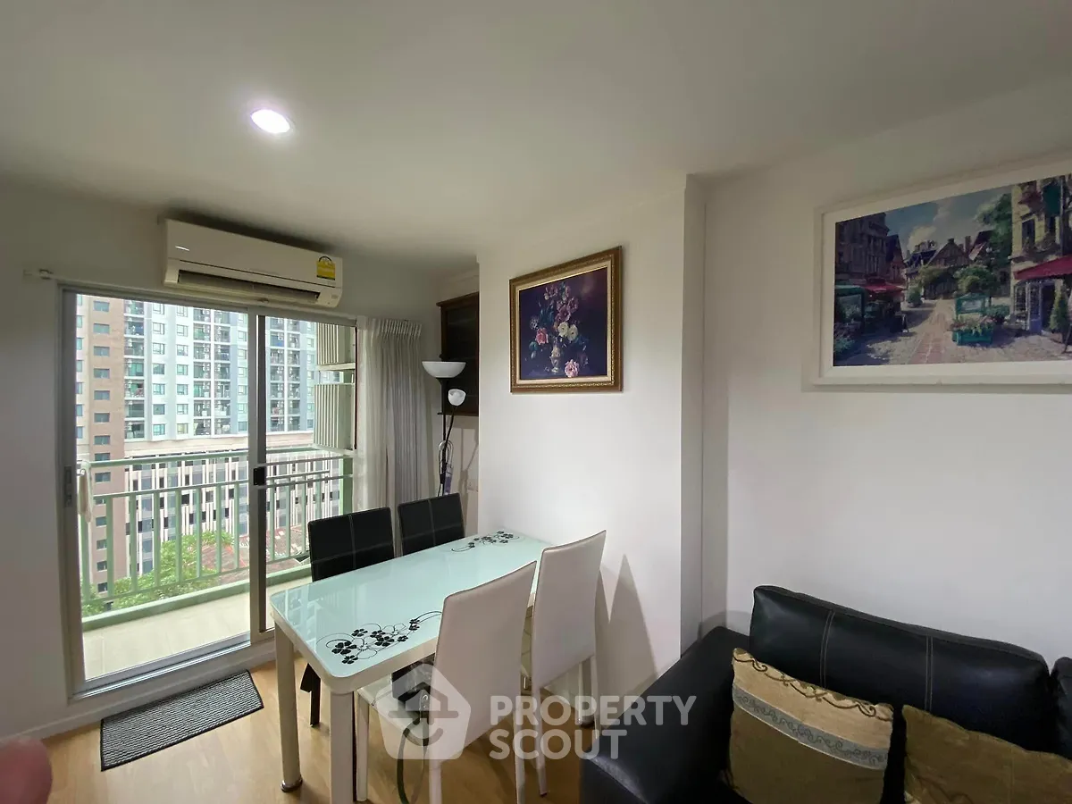 Modern living room with balcony view in high-rise apartment