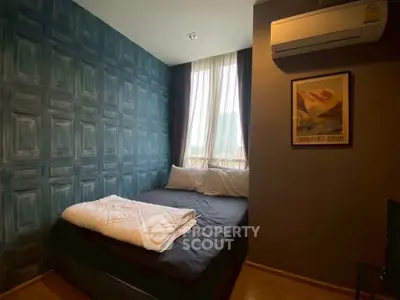 Cozy bedroom with stylish accent wall and natural light