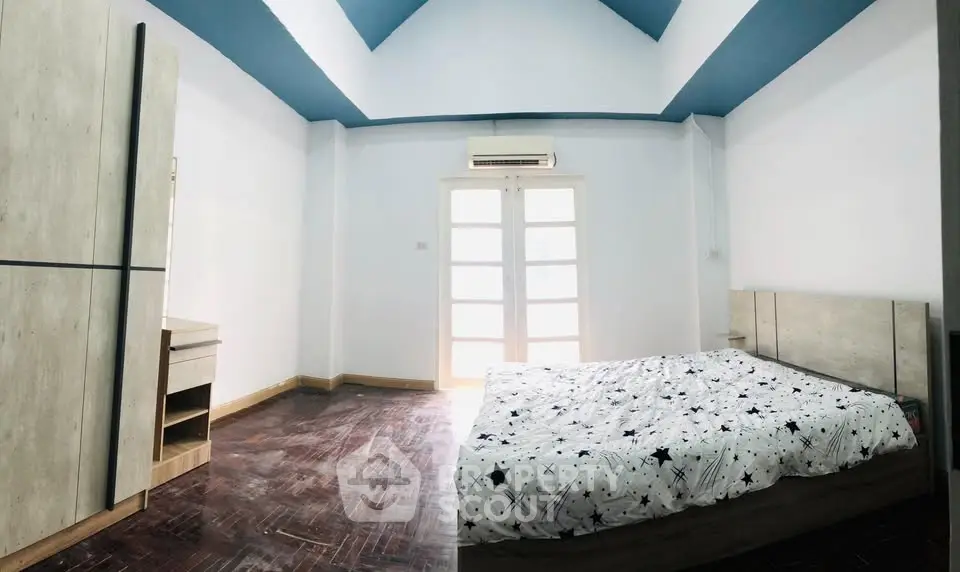 Spacious bedroom with modern design and natural light