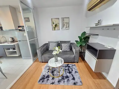 Modern living room with stylish decor and open kitchen layout