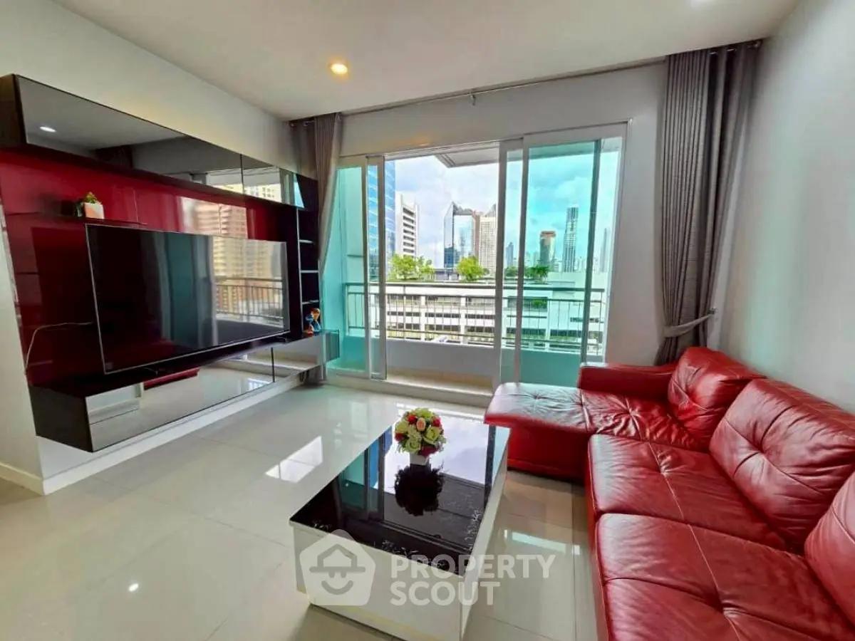 Modern living room with red leather sofa and city view balcony
