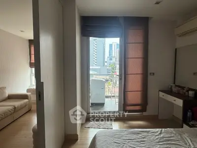 Modern bedroom with balcony view in urban apartment