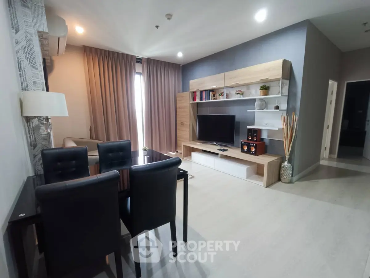 Modern living room with stylish furniture and entertainment center