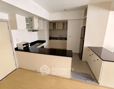 Modern kitchen with sleek black countertops and open layout design