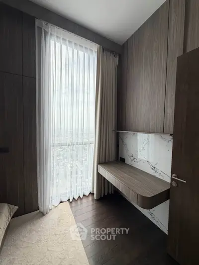 Luxurious bedroom with floor-to-ceiling window and elegant wood paneling