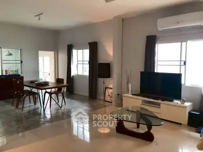 Spacious modern living room with dining area and stylish furniture