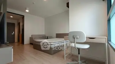 Modern minimalist bedroom with study area and large window