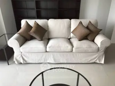 Elegant living room with plush white sofa and modern decor