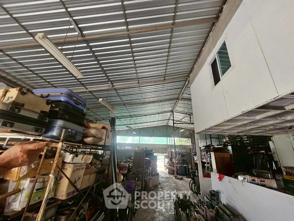 Spacious warehouse with metal roofing and ample storage space